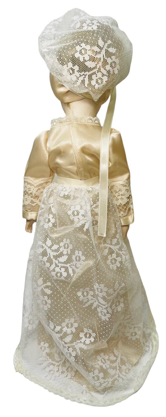 PORCELAIN DOLL 14" WEARING CREAM LACE SATIN GOWN W/MATCHING LACE BONNET.
